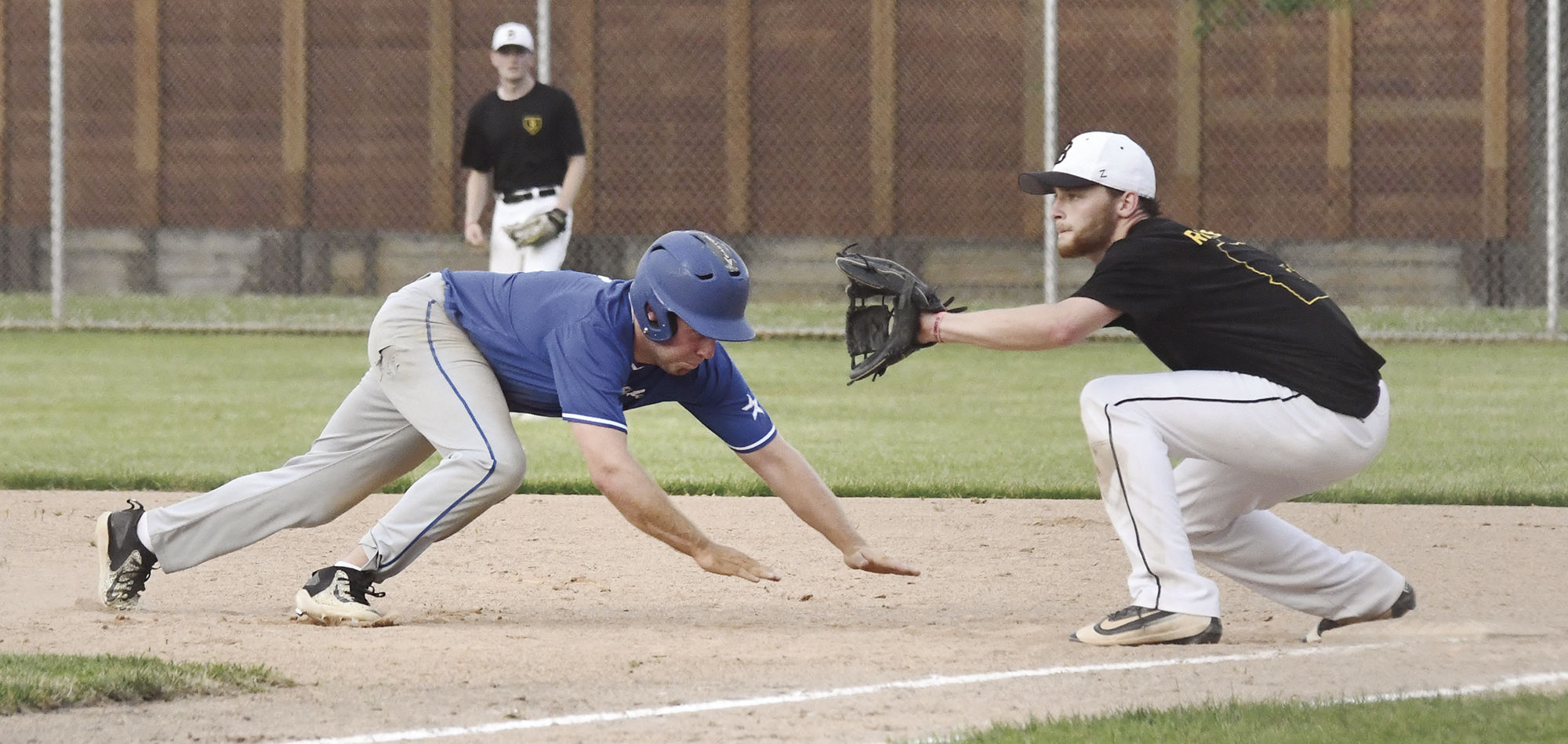 Knoll dives back to first base